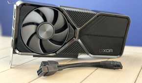 nvidia geforce rtx 4070 super founders edition stood up on table with pcie power adapter in front