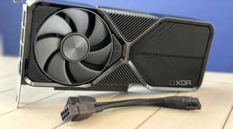 nvidia geforce rtx 4070 super founders edition stood up on table with pcie power adapter in front
