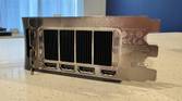 end view of the nvidia geforce rtx 4080 super fe io shield showing all four ports and the exhaust fan grille