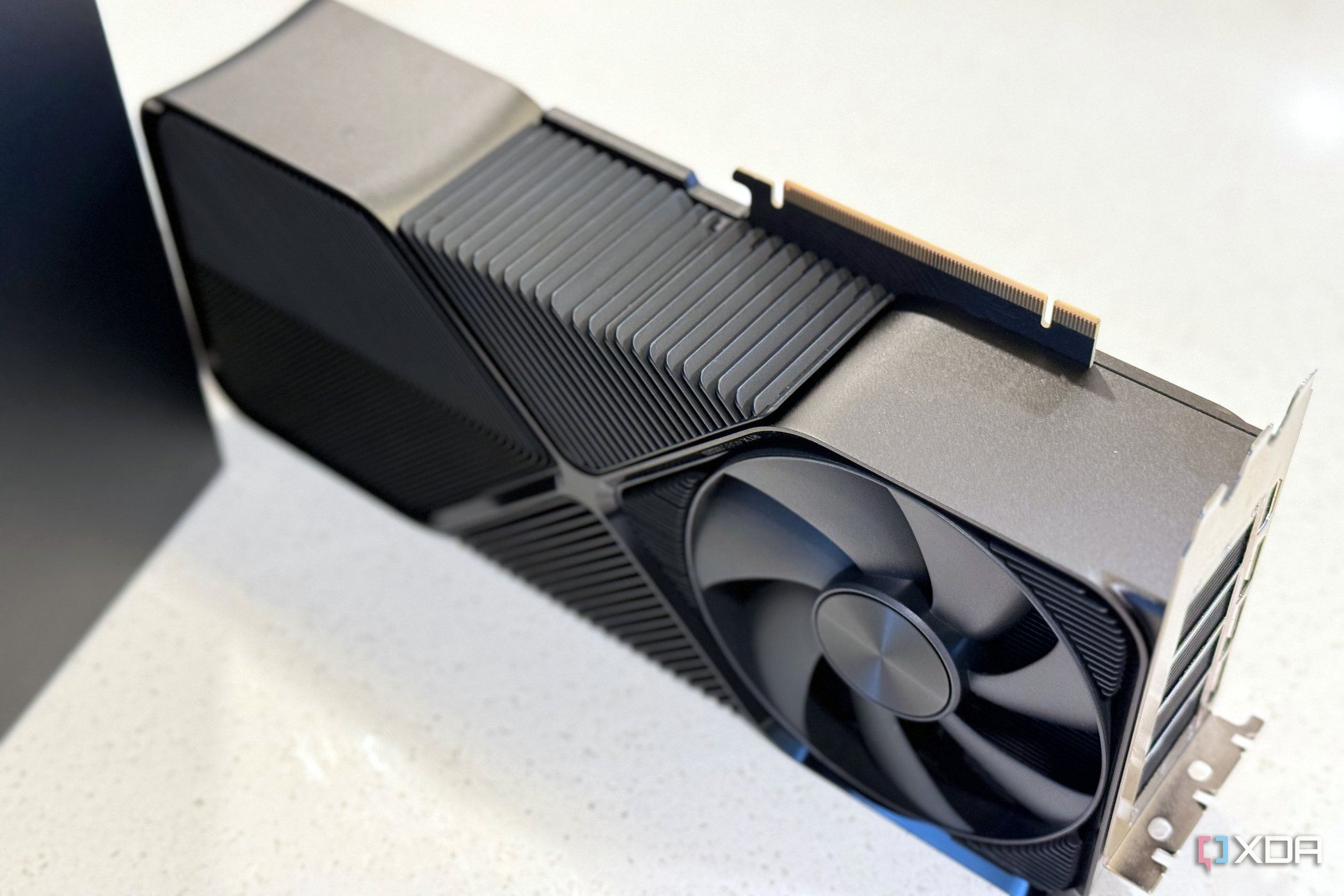 nvidia geforce rtx 4080 super fe stood up on its side to show how thick it is