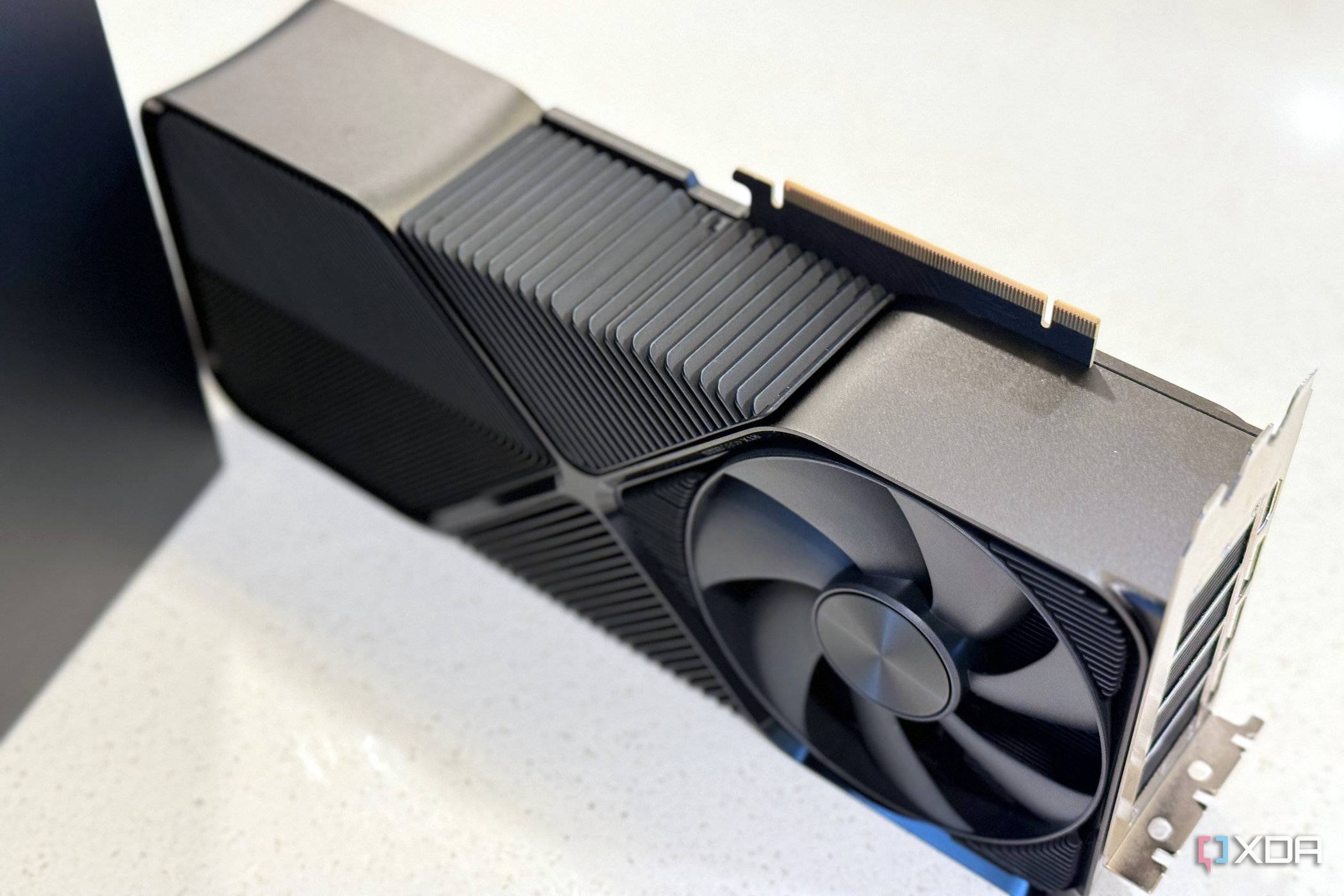 nvidia geforce rtx 4080 super fe stood up on its side to show how thick it is