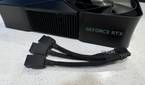 nvidia geforce rtx 4080 super fe on a table with the three cable power adapter in front of it