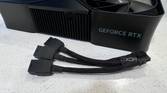 nvidia geforce rtx 4080 super fe on a table with the three cable power adapter in front of it
