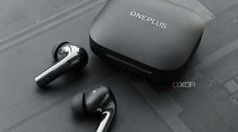 An image showing a pair of OnePlus Buds 3 earbuds sitting next to its charging case.