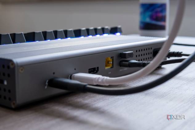 Close-up of multiple cables plugged into the rear ports of the OWC Thunderbolt Go Dock