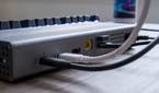 Close-up of multiple cables plugged into the rear ports of the OWC Thunderbolt Go Dock