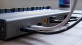Close-up of multiple cables plugged into the rear ports of the OWC Thunderbolt Go Dock