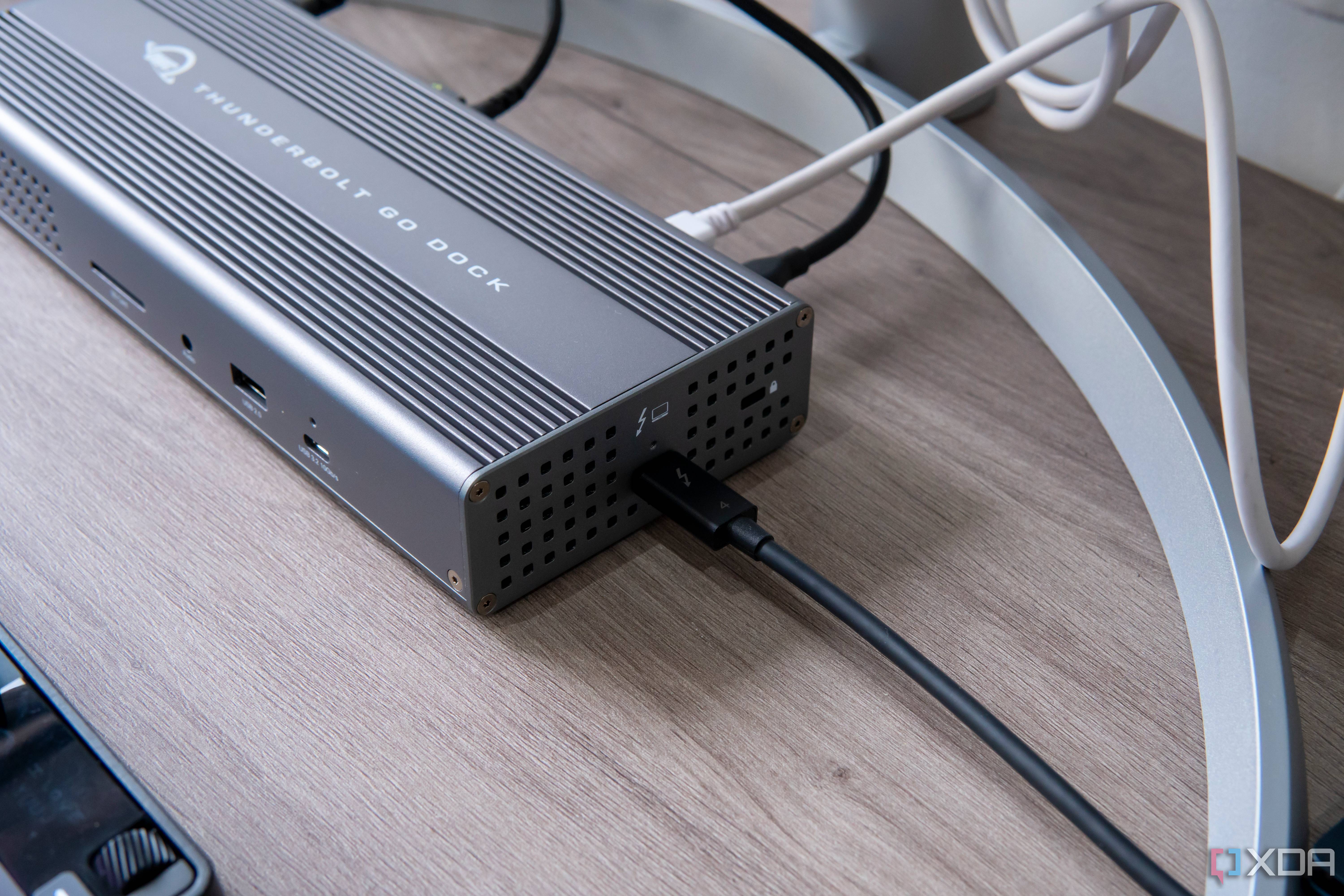 Angled view of the OWC Thunderbolt Go DOck showing the host connection and the front ports