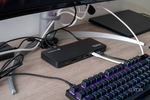 Angled view of the Plugable TBT4-UD5 docking station in a desk setup