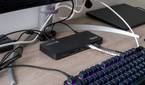 Angled view of the Plugable TBT4-UD5 docking station in a desk setup