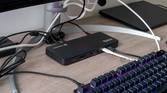 Angled view of the Plugable TBT4-UD5 docking station in a desk setup