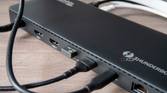 Close-up of the USB ports on the back of the Plugable TBT4-UD5 docking station with peripherals connected