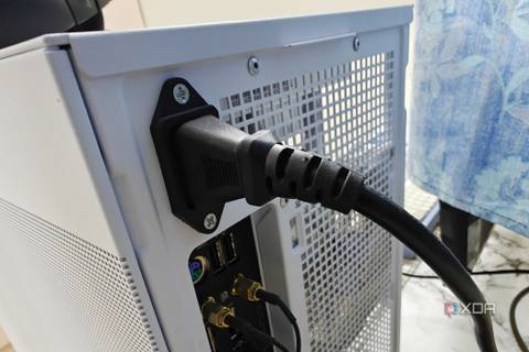 An image showing the power cable connected to the back of the PSU.