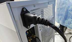 An image showing the power cable connected to the back of the PSU.