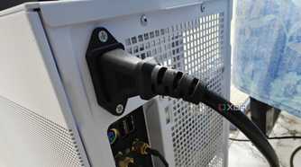 An image showing the power cable connected to the back of the PSU.