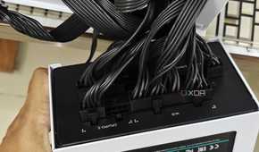 An image showing a PSU with a bunch of power cables connected to it.