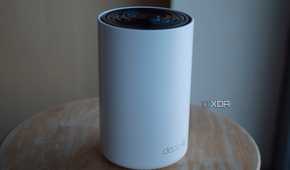 TP-Link Deco XE75 on a desk with the sun shining on it
