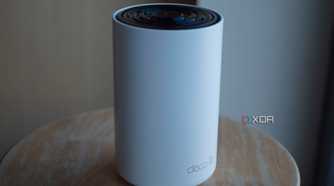 TP-Link Deco XE75 on a desk with the sun shining on it