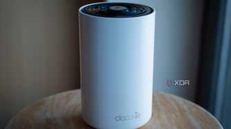 TP-Link Deco XE75 node sitting on a table