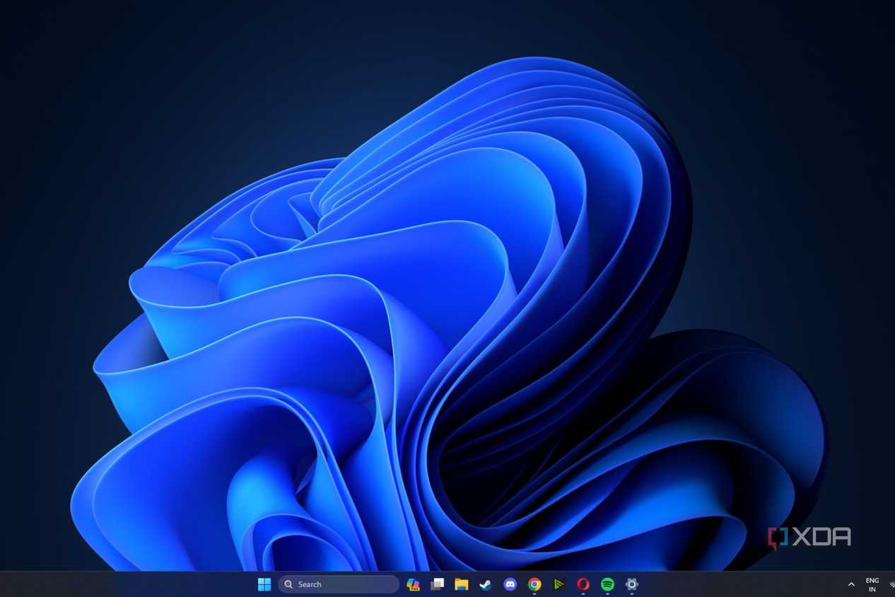 A screenshot showing the Windows 11 Blossam wallpaper with the dark theme enabled.