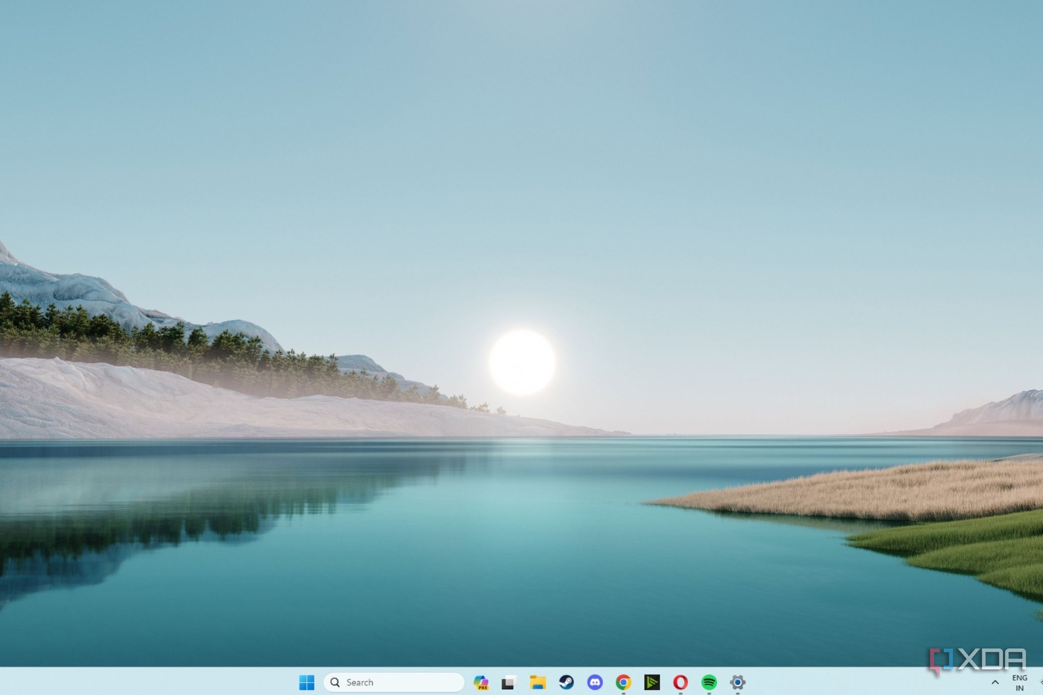 A screenshot showing the Windows 11 sunrise wallpaper.
