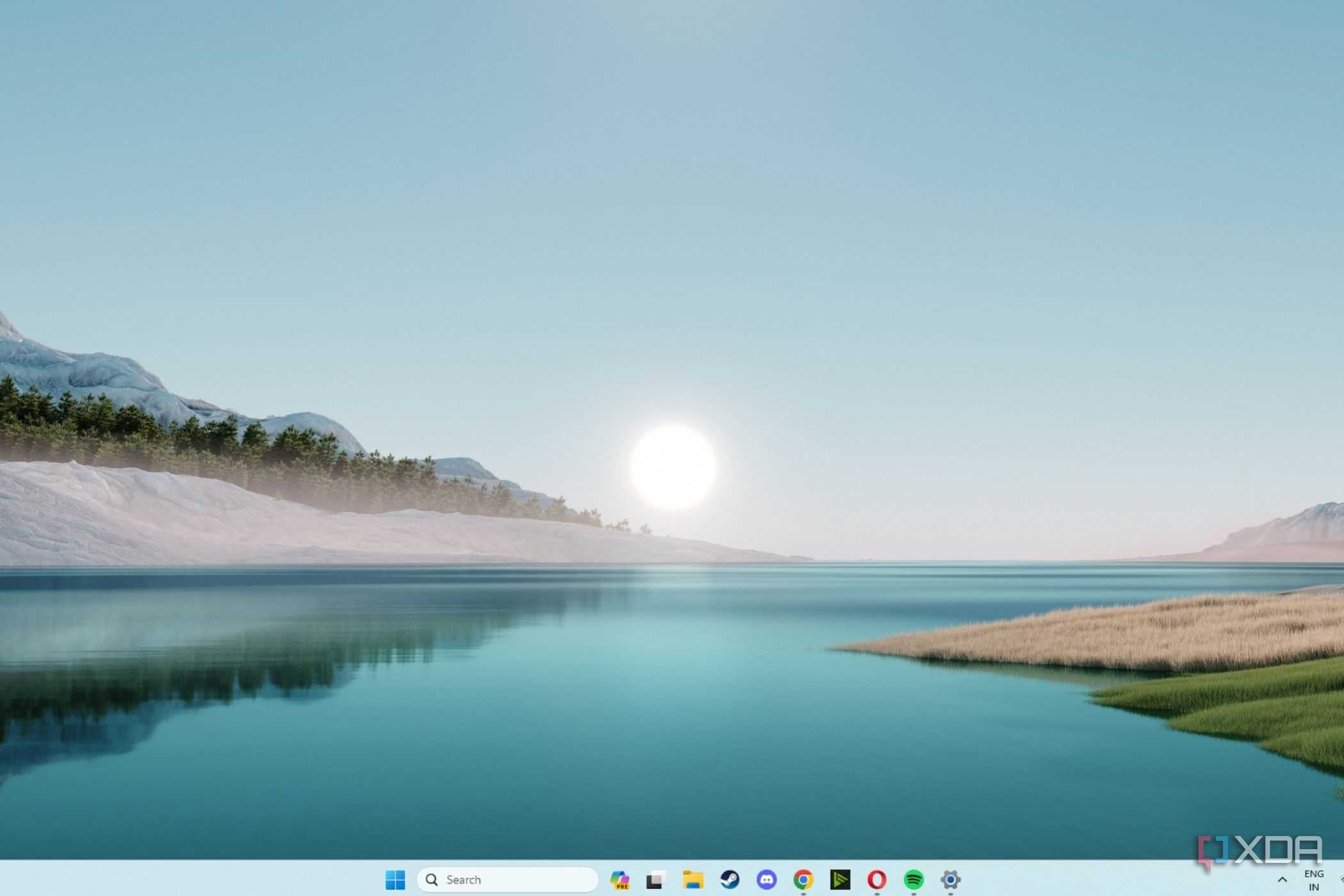 A screenshot showing the Windows 11 sunrise wallpaper.