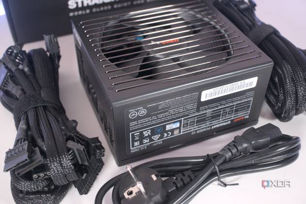 A BeQuiet Pure Power 12M PSU box contents laid out on a white surface