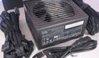 A BeQuiet Pure Power 12M PSU box contents laid out on a white surface