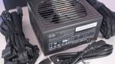 A BeQuiet Pure Power 12M PSU box contents laid out on a white surface