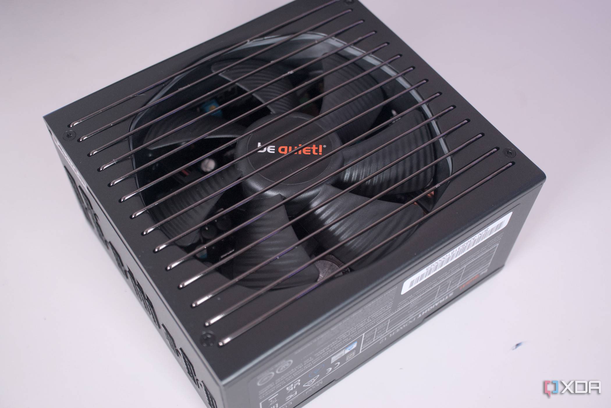 be quiet! Pure Power 12 M 850W power supply on a white desk.