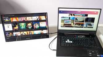 desklabs portable monitor showing netflix laptop showing xda website