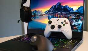 A collection of gaming accessories with an HP Omen in the background