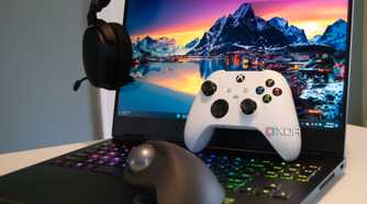 A collection of gaming accessories with an HP Omen in the background