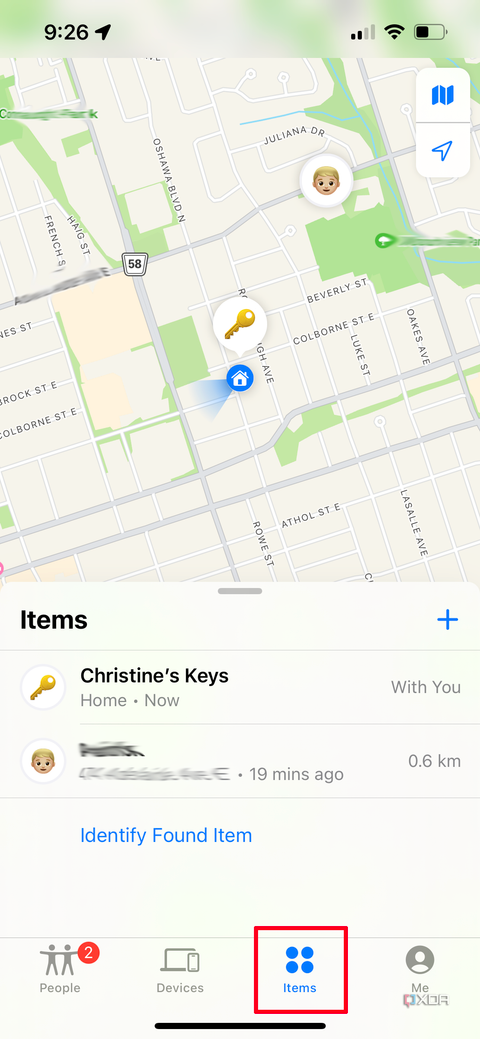 A Find My page on iPhone with the Items tab open showing two tracked items