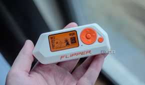 Flipper Zero in ahnd, showing home screen
