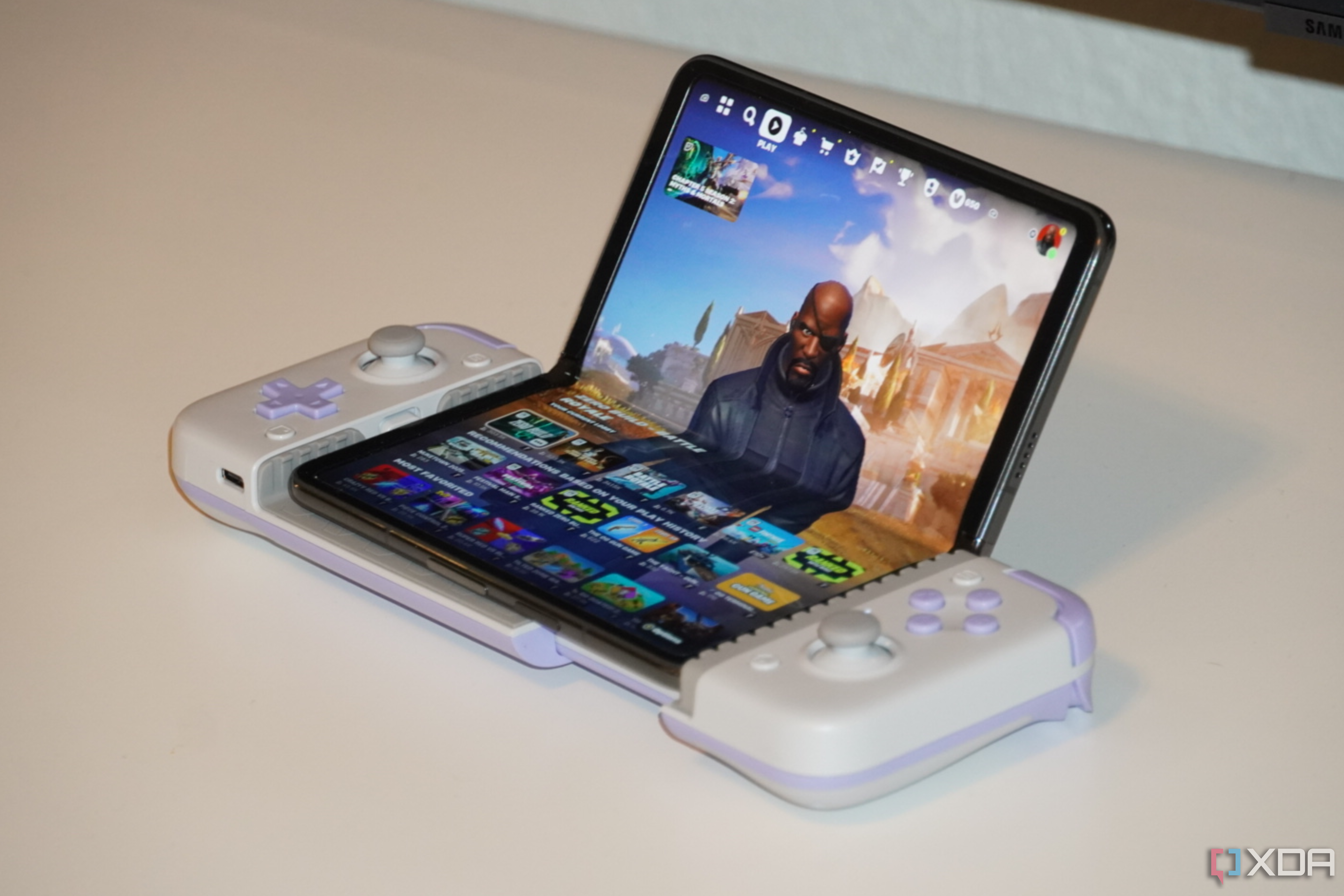 The Fortnite menu on a Pixel Fold in a GameSir X2s controller.