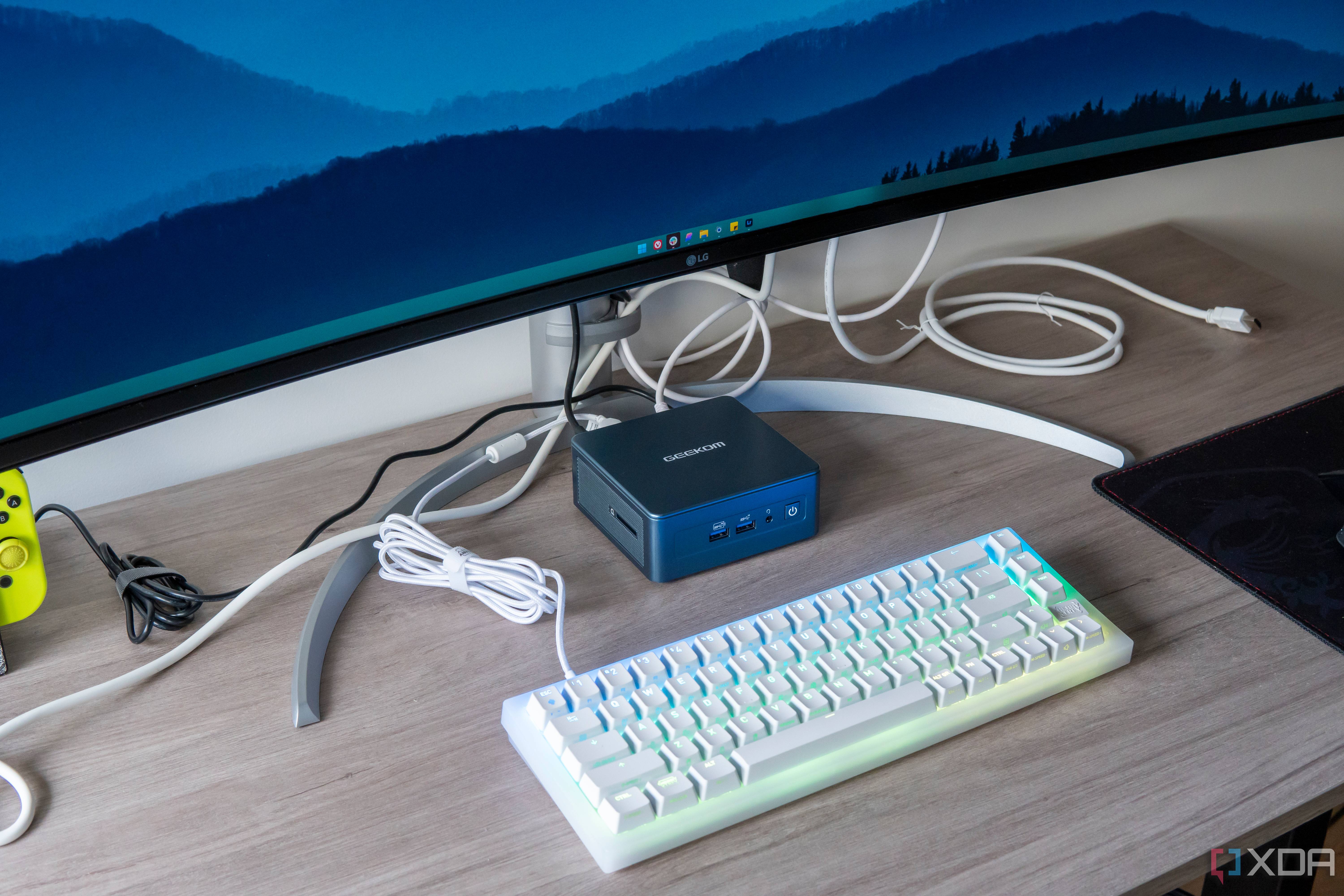 A Geekom Mini IT13 in a desk setup