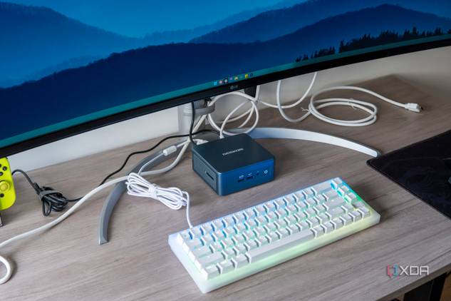 A Geekom Mini IT13 in a desk setup