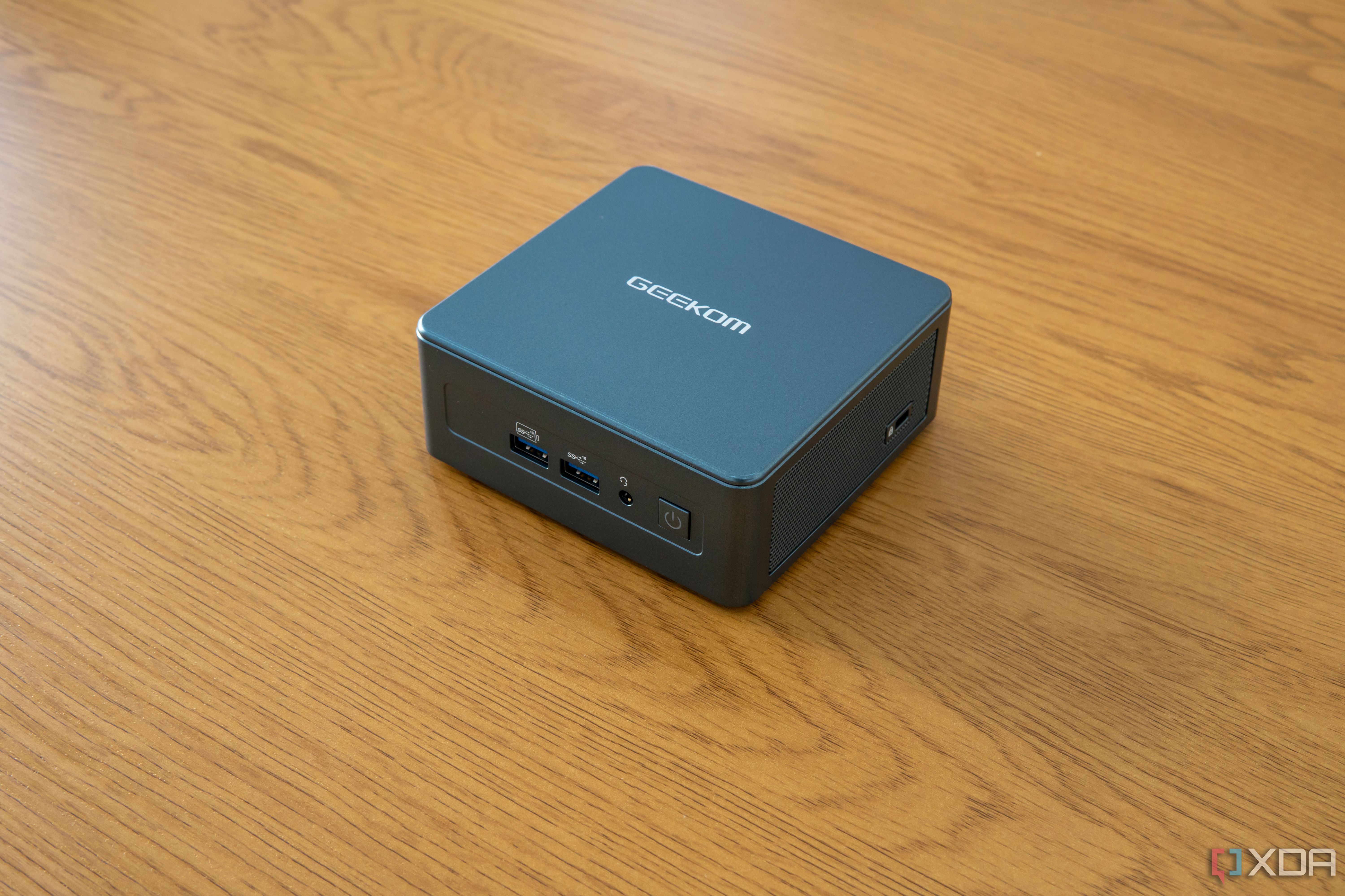 Geekom Mini IT13 mini PC on a wooden desk