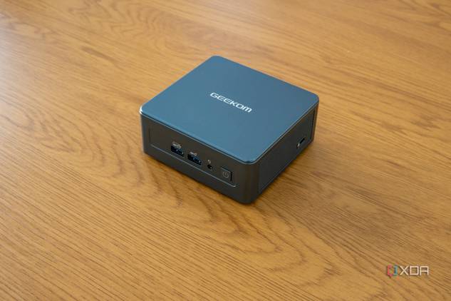 Geekom Mini IT13 mini PC on a wooden desk