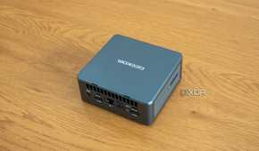 Angled rear view Geekom Mini IT13 mini PC on a wooden table