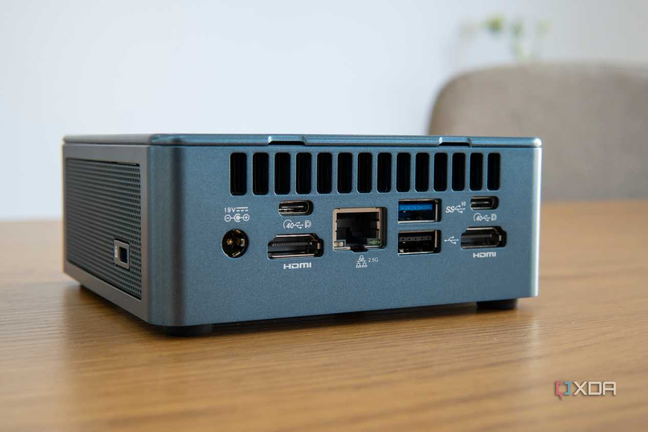 Angled rear view of the Geekom Mini IT13 on a wooden table