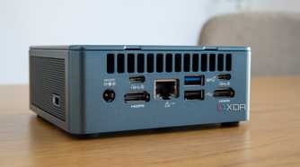Angled rear view of the Geekom Mini IT13 on a wooden table