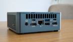 Angled rear view of the Geekom Mini IT13 on a wooden table