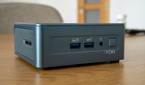 Angled front view of the Geekom Mini IT13 on a wooden table
