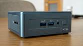 Angled front view of the Geekom Mini IT13 on a wooden table