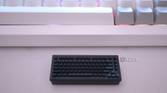 Keychron's wireless receiver in front of a keyboard