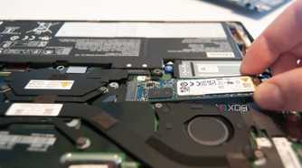 Pull the SSD out of the slot at about a 20-degree angle