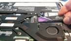 Slide the new SSD into the slot at a 20-degree angle