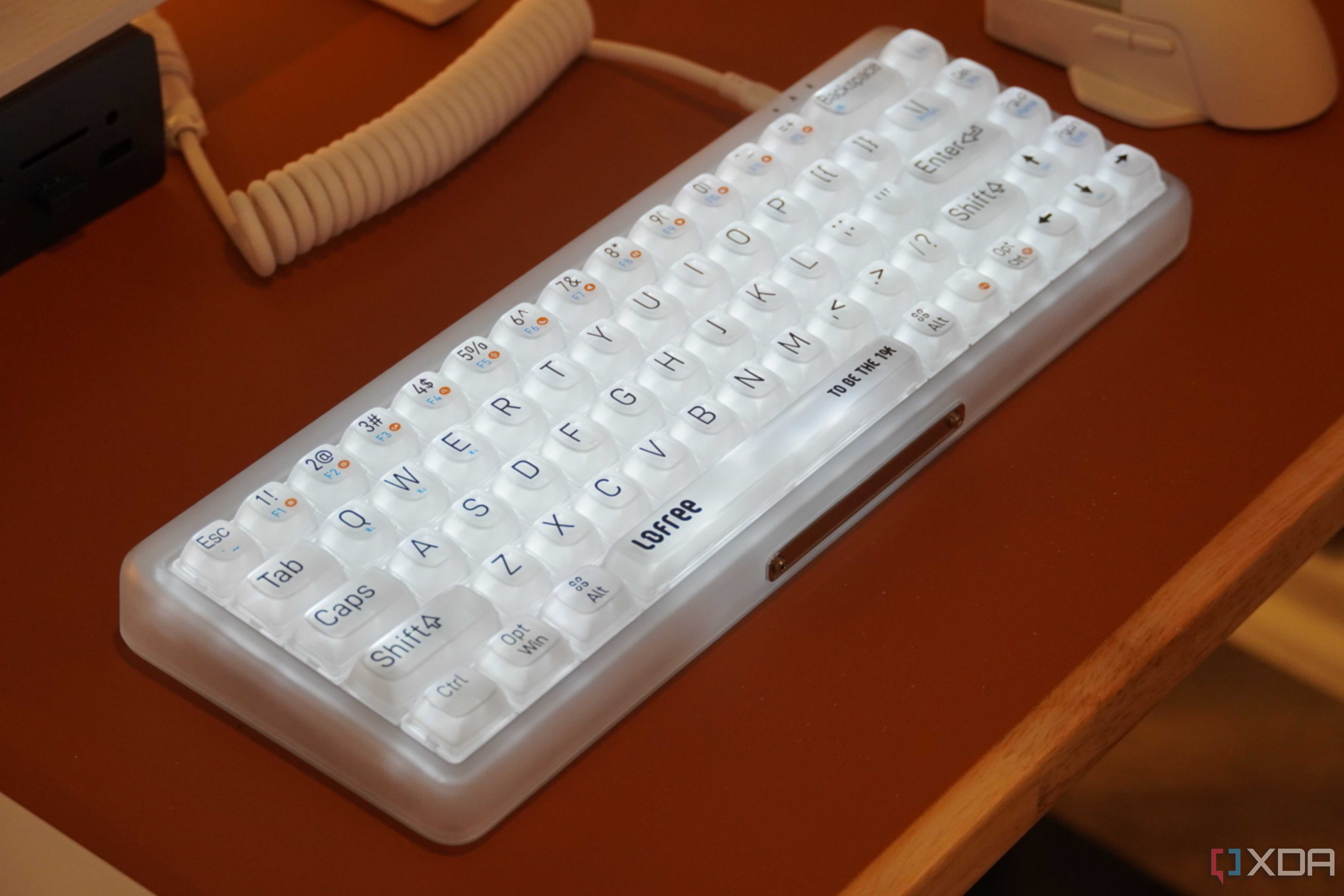 The Lofree 1% "Misty" mechanical keyboard on a desk.
